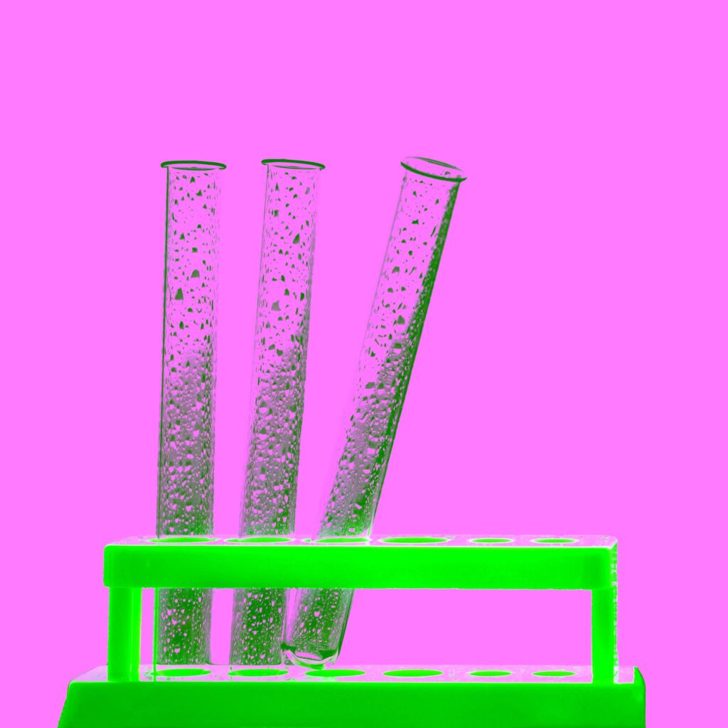 Test tube rack with assorted glass tubes for lab experiments